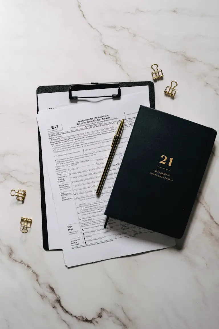 Black Notebook and Paper on the Clipboard