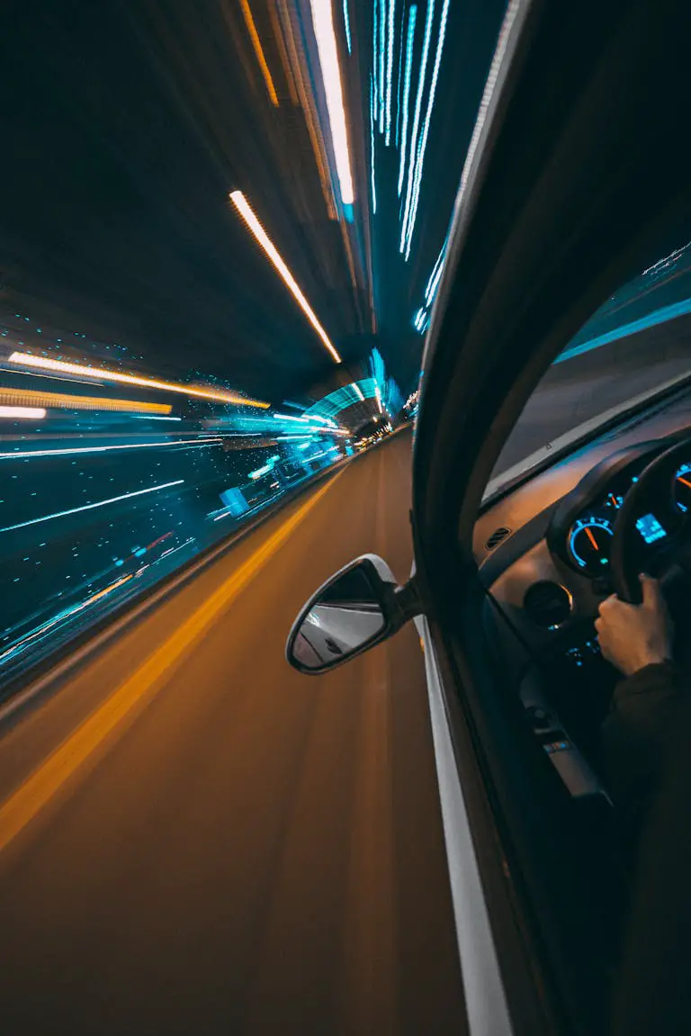 Close-up Shot of Fast Moving Car on the Road